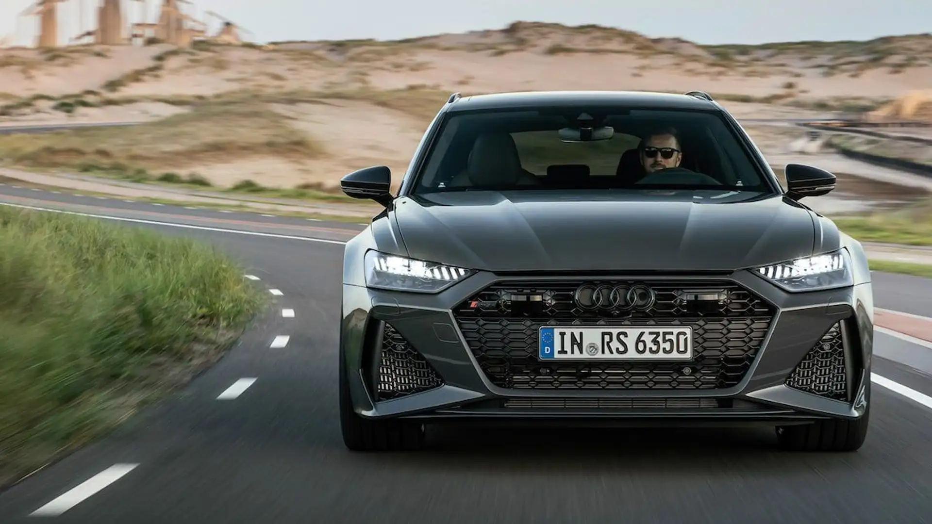 Audi RS6 Frontansicht daytona grau auf kurviger Landstraße
