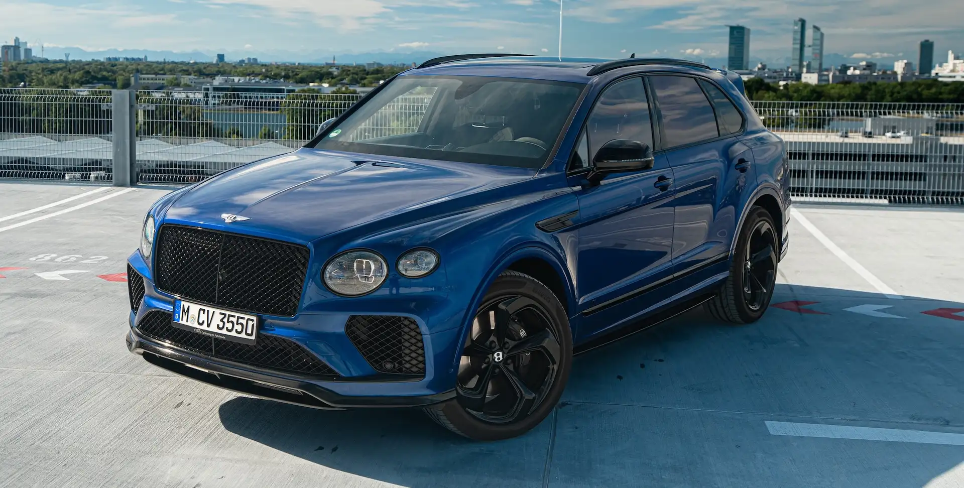 Bentley Bentayga V8S in blue on parking garage
